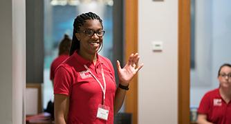 An image of a student waving